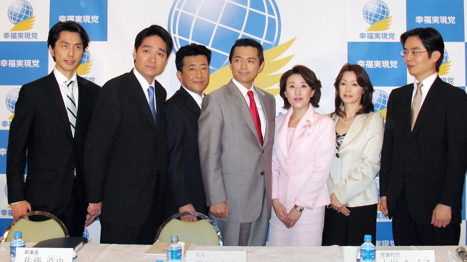 Happiness Realisation Party candidates, including Jay Aeba (seen in the grey suit at centre), at a Tokyo hotel in 2009.  (Photo: Harumi Ozawa, Getty Images)