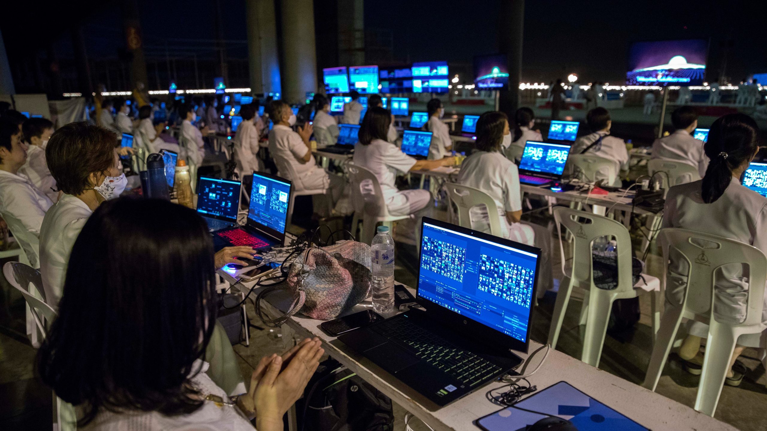 Volunteers manage a global Zoom call of over 200,000 participants at Wat Dhammakaya on February 26, 2021 in Bangkok, Thailand. (Photo: Lauren DeCicca, Getty Images)