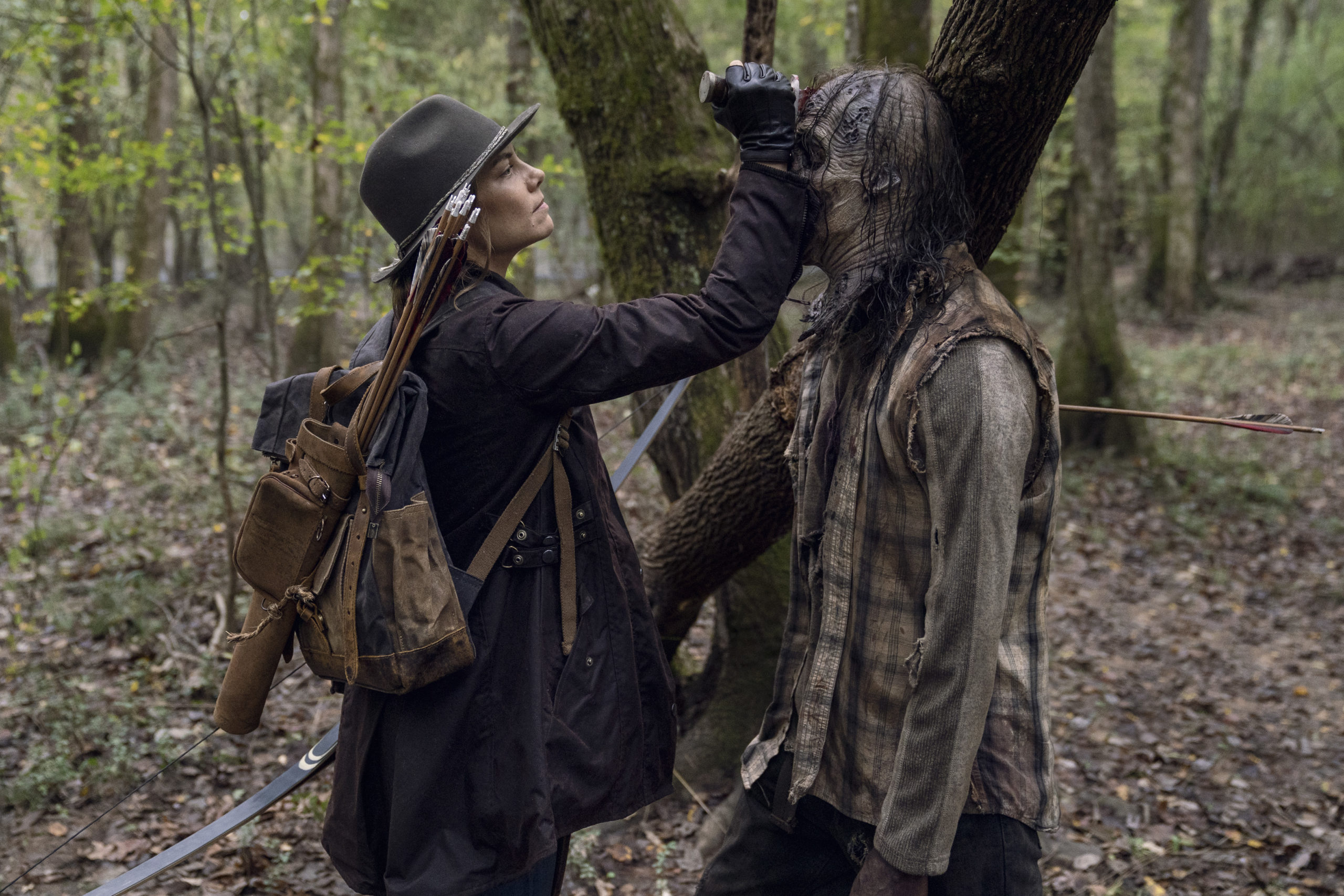 Maggie, uh, gently lays her forearm on a zombie's face. (Photo: Eli Ade/AMC)