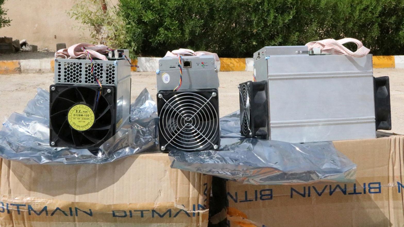 Boxes of machinery used in bitcoin mining operations that were confiscated by police in Nazarabad, Iran. (Photo: Police News Agency, AP)