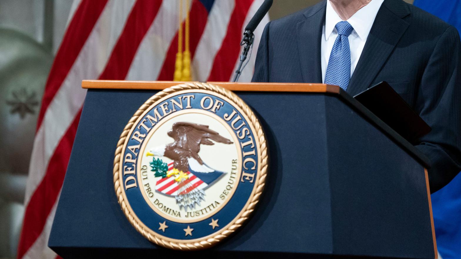 The seal of the U.S. Department of Justice as Attorney General Merrick Garland addresses staff on his first day in March 2021. (Photo: Kevin Dietsch/Pool, Getty Images)