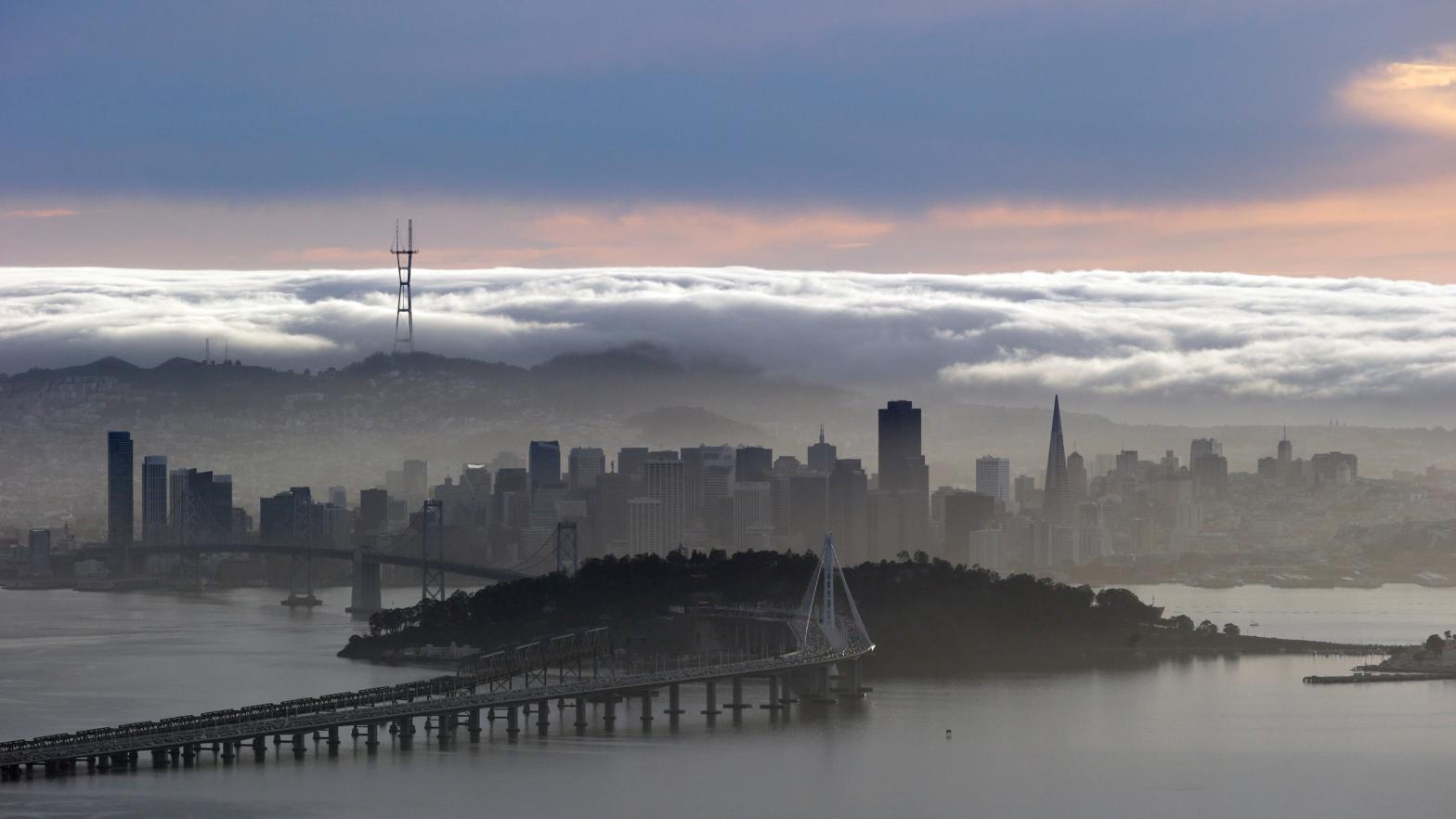 A blanket of fog covers the San Francisco skyline in a view from the Berkeley Hills. (Photo: Marcio Jose Sanchez, AP)