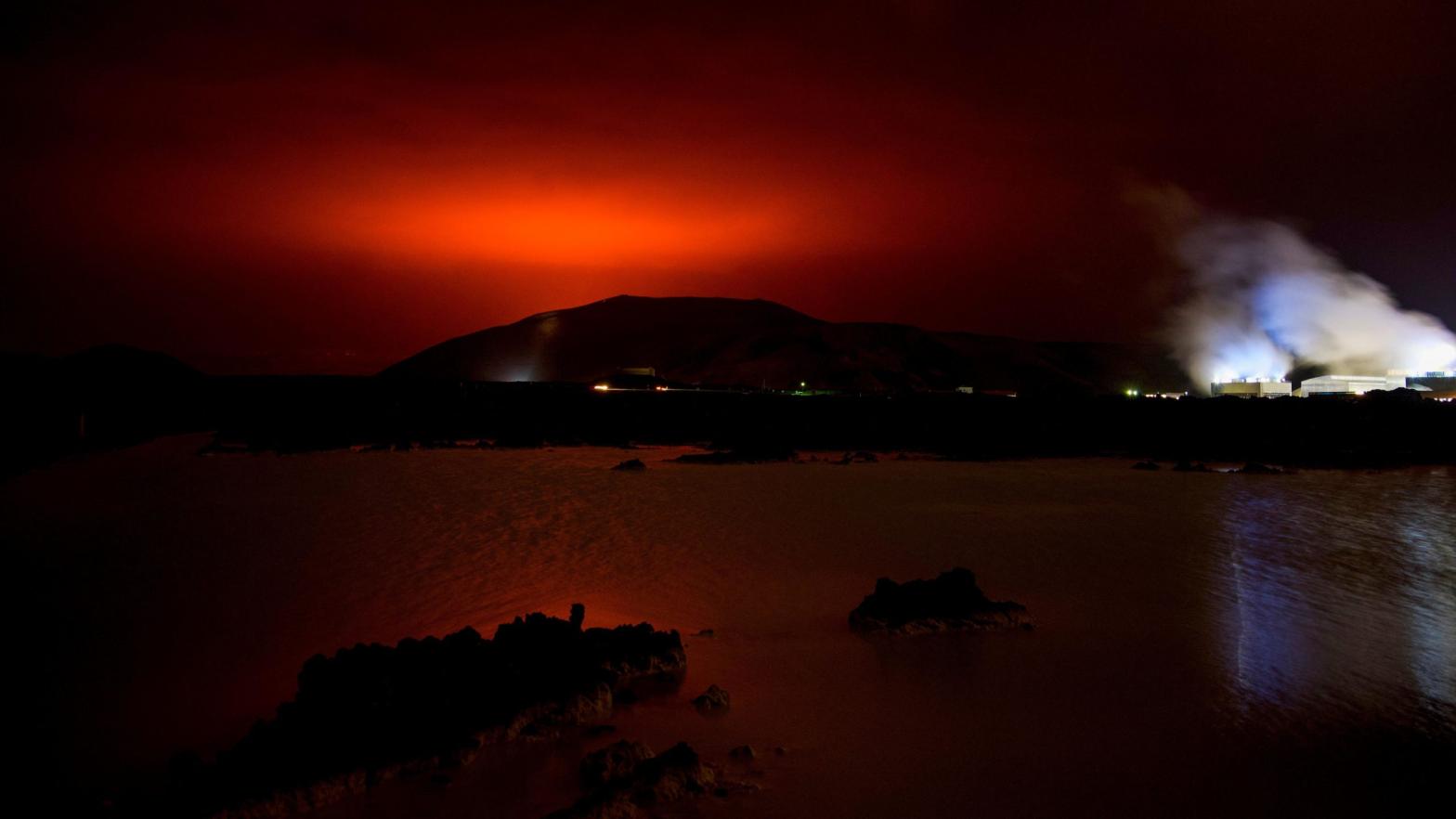 A volcano erupted near Iceland's capital Reykjavík on Friday, shooting up a fountain of lava that lit the night sky following thousands of small earthquakes in recent weeks. (Photo: Halldor Kolbeins/AFP, Getty Images)