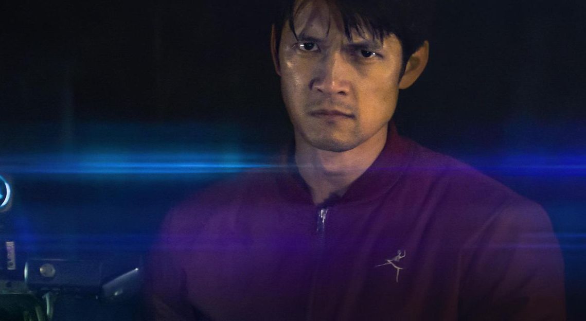 James (Harry Shum Jr.) becomes obsessed with his quest in Broadcast Signal Intrusion. (Image: Courtesy Queensbury Pictures)
