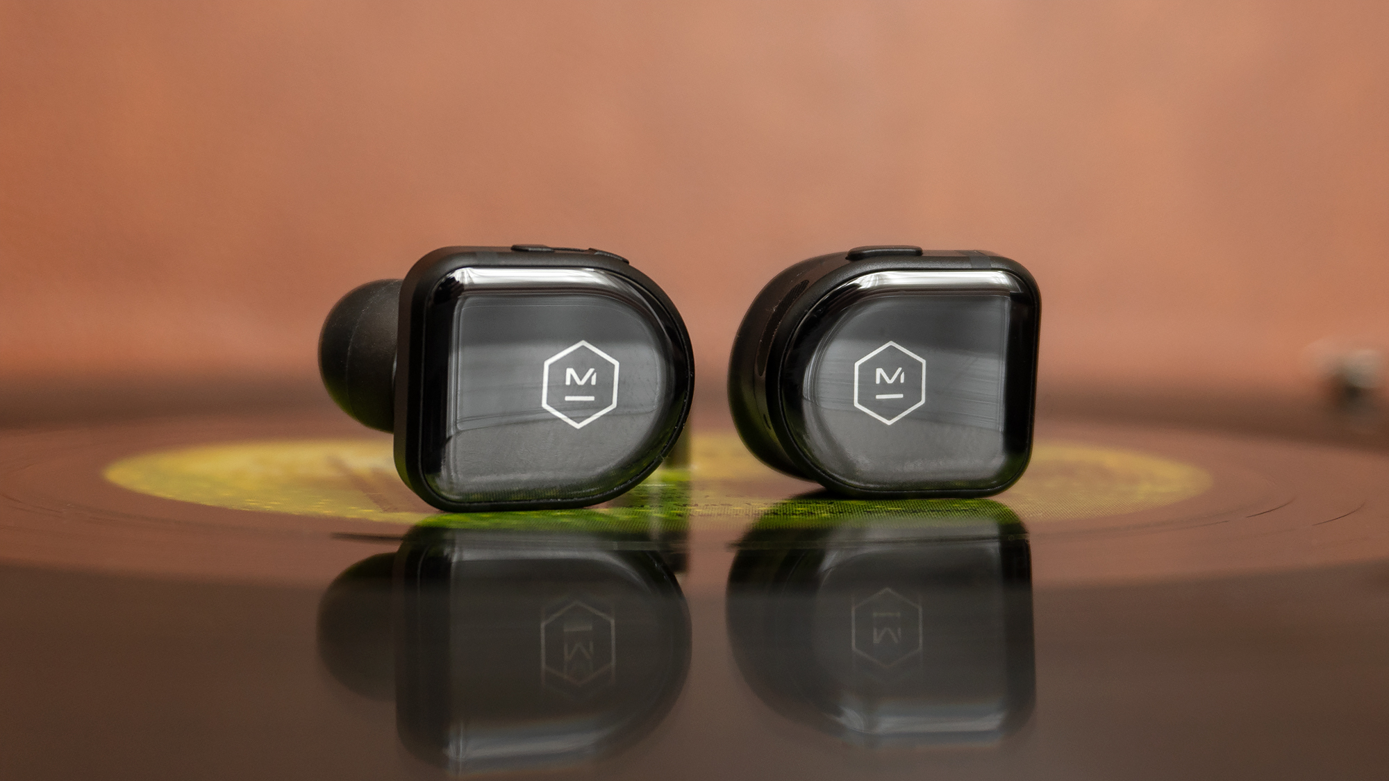 Instead of tap controls which can often dislodge earbuds, the MW08s feature physical buttons for quick access to commonly used controls. (Photo: Andrew Liszewski/Gizmodo)