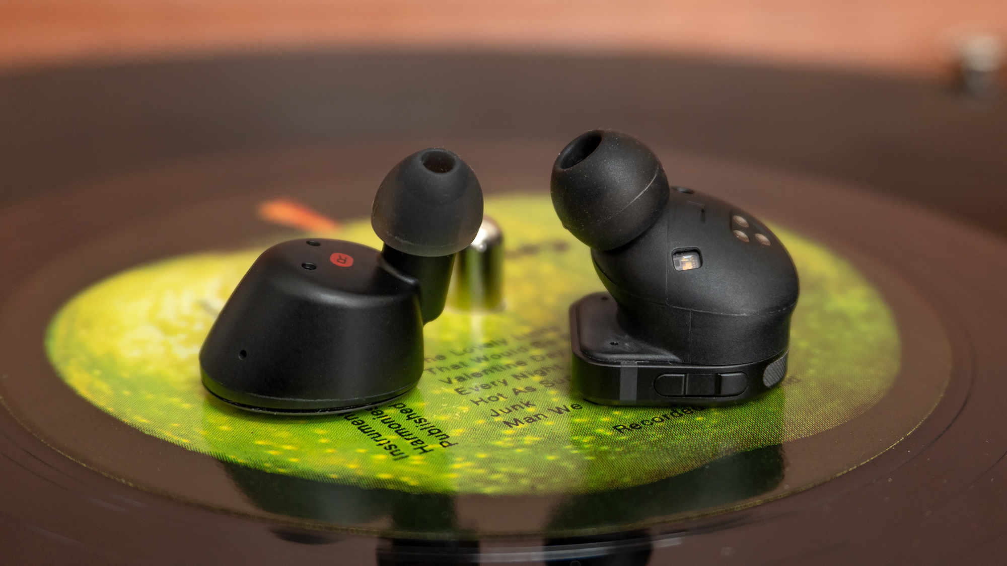 The sound quality of the Klipsch  T5 II True Wireless earbuds (left) comes close to the Master & Dynamic MW08s (right), but Klipsch's design doesn't stay in the ear as well as M&D's. (Photo: Andrew Liszewski/Gizmodo)