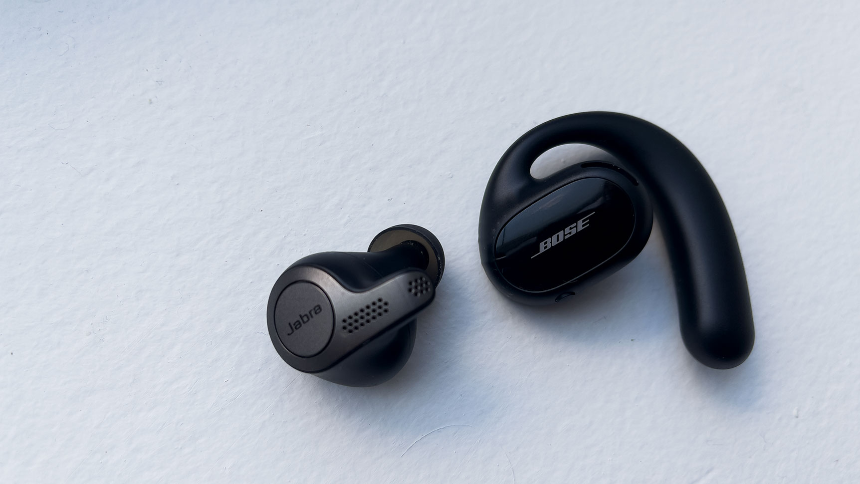 My Jabra Elite 59 T are much smaller and lighter than the Bose Sport Open Earbuds. (Photo: Victoria Song/Gizmodo)