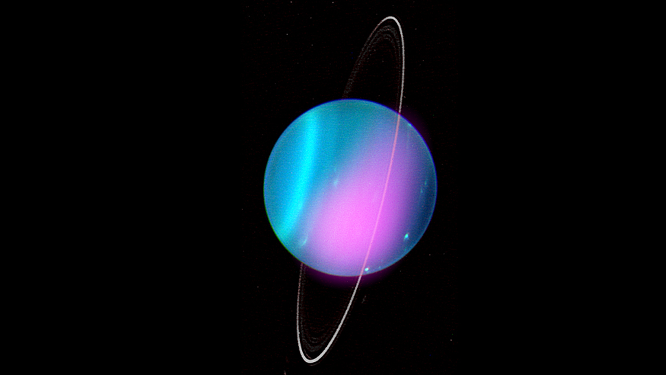 Composite image of Uranus, composed of an X-ray image taken by Chandra (shown in pink) and an optical image taken by the Keck-I Telescope.  (Image: X-ray: NASA/CXO/University College London/W. Dunn et al; Optical: W.M. Keck Observatory)