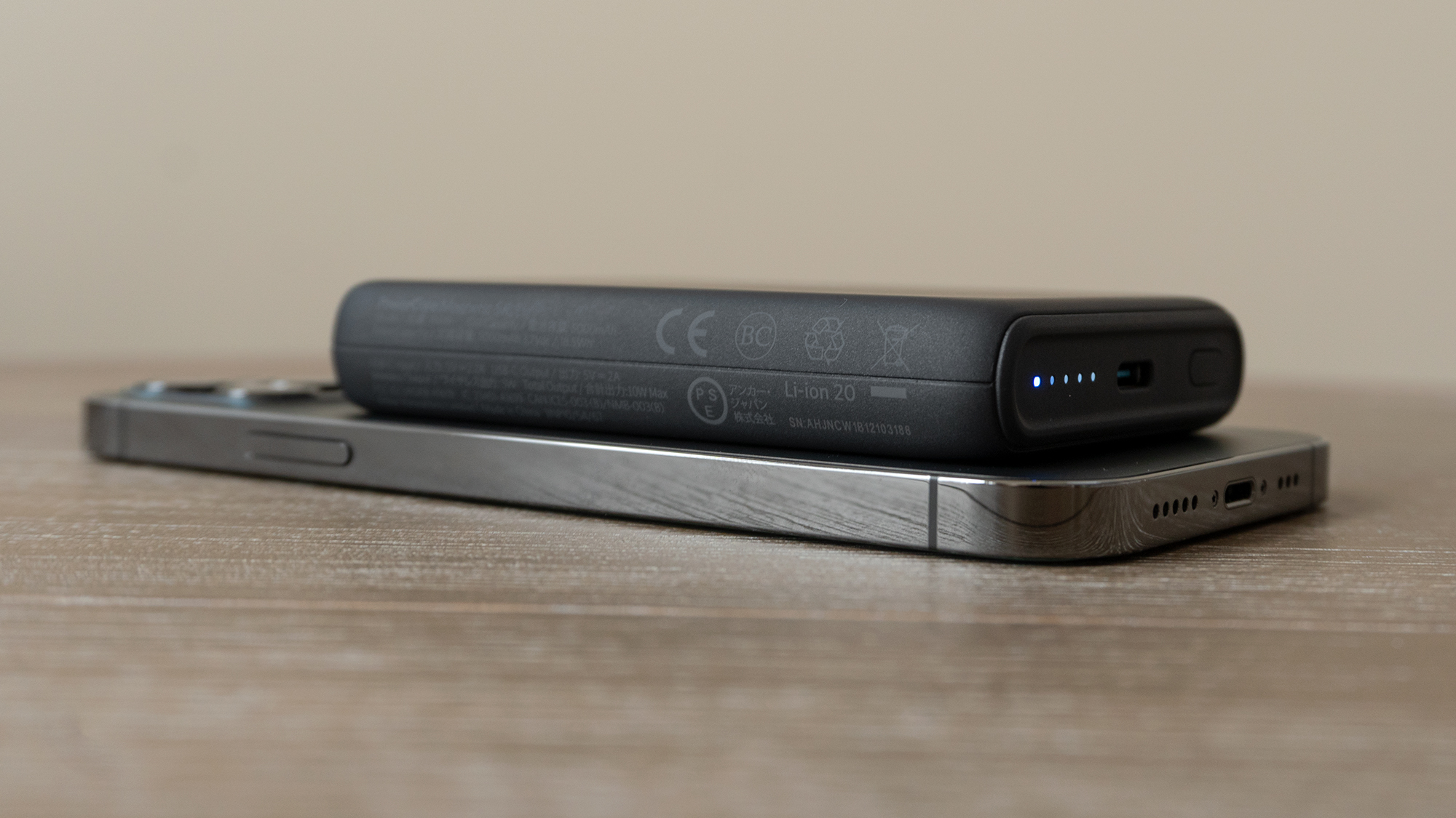 There's no getting around it: Anker's MagSafe-compatible portable wireless charger will add some bulk to your iPhone 12. (Photo: Andrew Liszewski/Gizmodo)