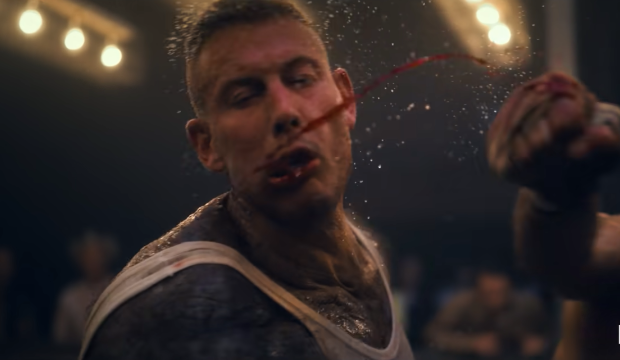 Luther (Tom Hopper) taking a punch in The Umbrella Academy's second season. (Screenshot: Netflix)