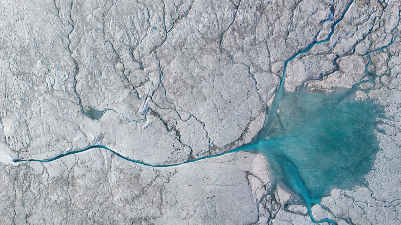 A stream of meltwater flowing into a moulin on the Greenland Ice sheet (Screenshot: NASA Goddard on Youtube, Other)