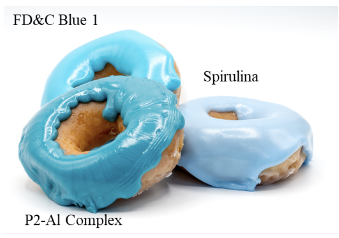 Doughnut icing made from a synthetic colorant (top), the new P2 compound (bottom left), and spirulina (right). (Image: P. R. Denish et al., 2021/Science Advances)