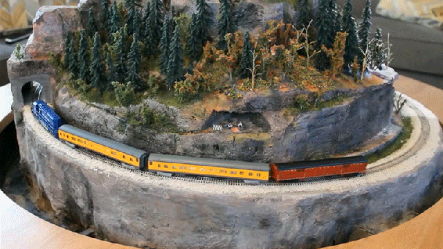 Every Coffee Table Should Have a Secret Pop-Up Miniature Model Railroad