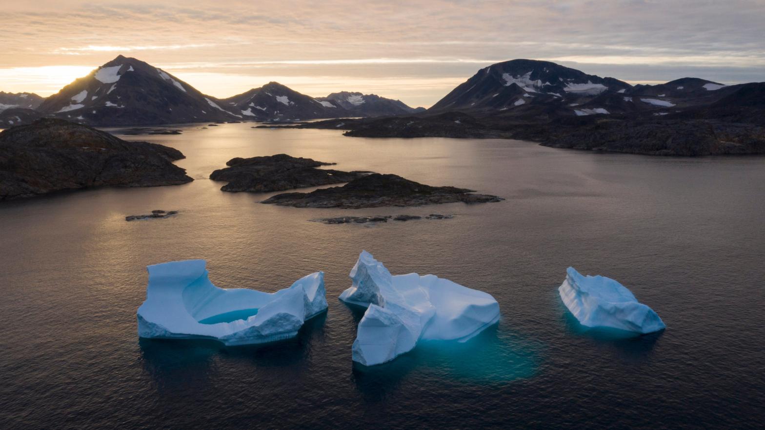 Icebergs float away as the sun rises near Kulusuk, Greenland in August 2019. (Photo: Felipe Dana, AP)