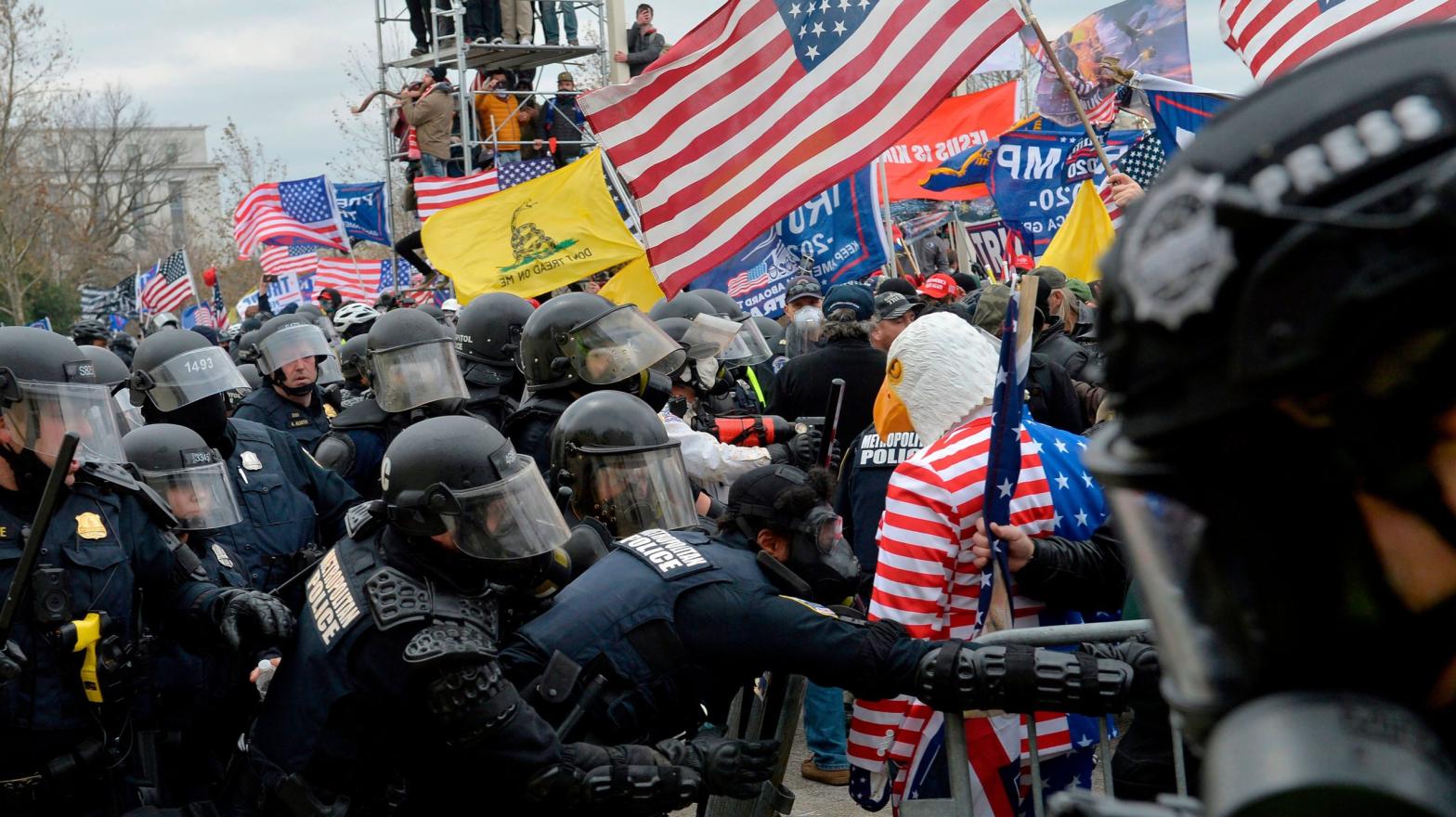Riot police clash with pro-Trump rioters outside the Capitol on Jan. 6, 2021. (Photo: Joseph Prezioso/AFP, Getty Images)