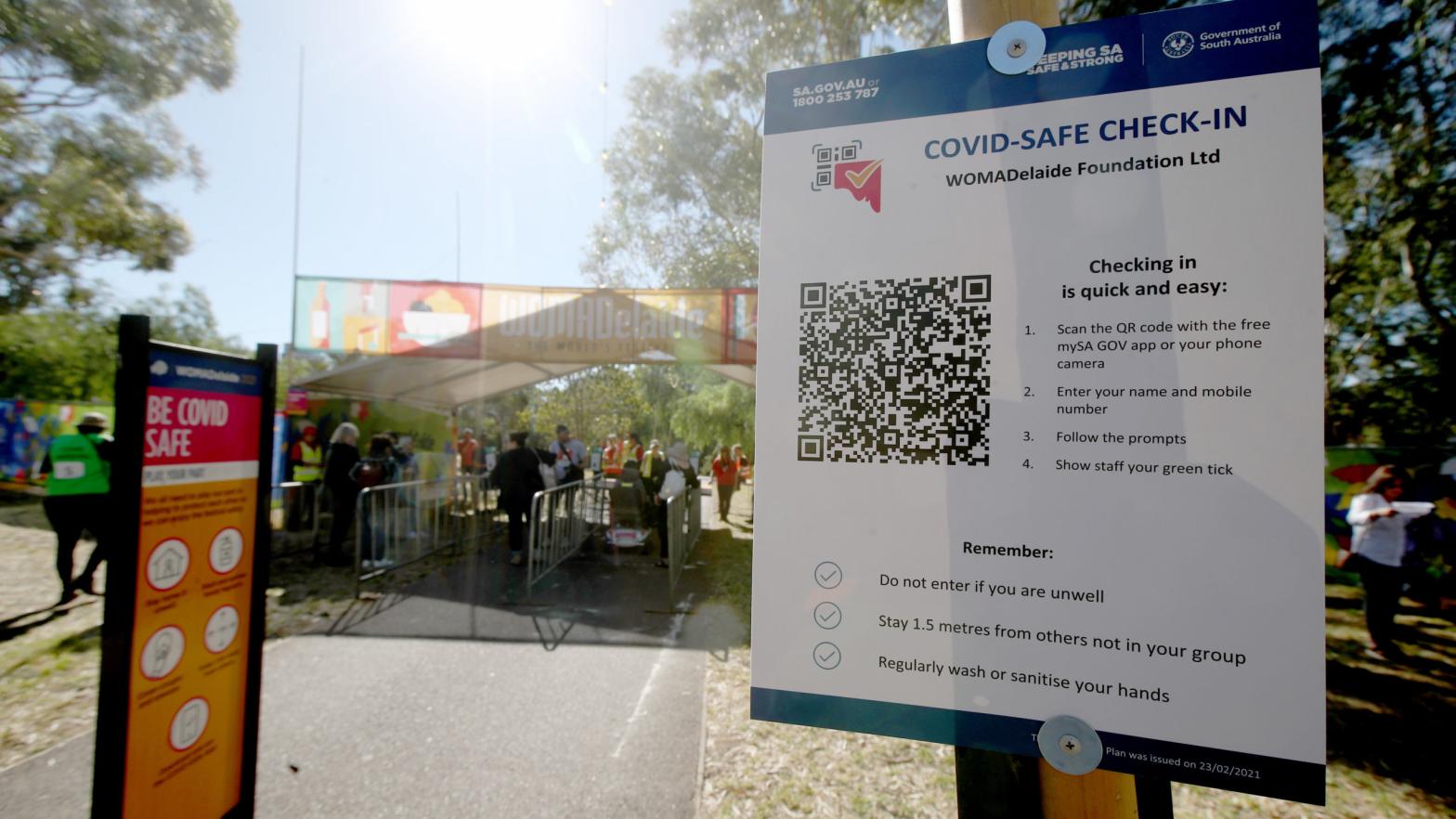 Patrons use the Covid safe QR codes before entering WOMADelaide 2021 on March 05, 2021 in Adelaide, Australia.  (Photo: Kelly Barnes, Getty Images)