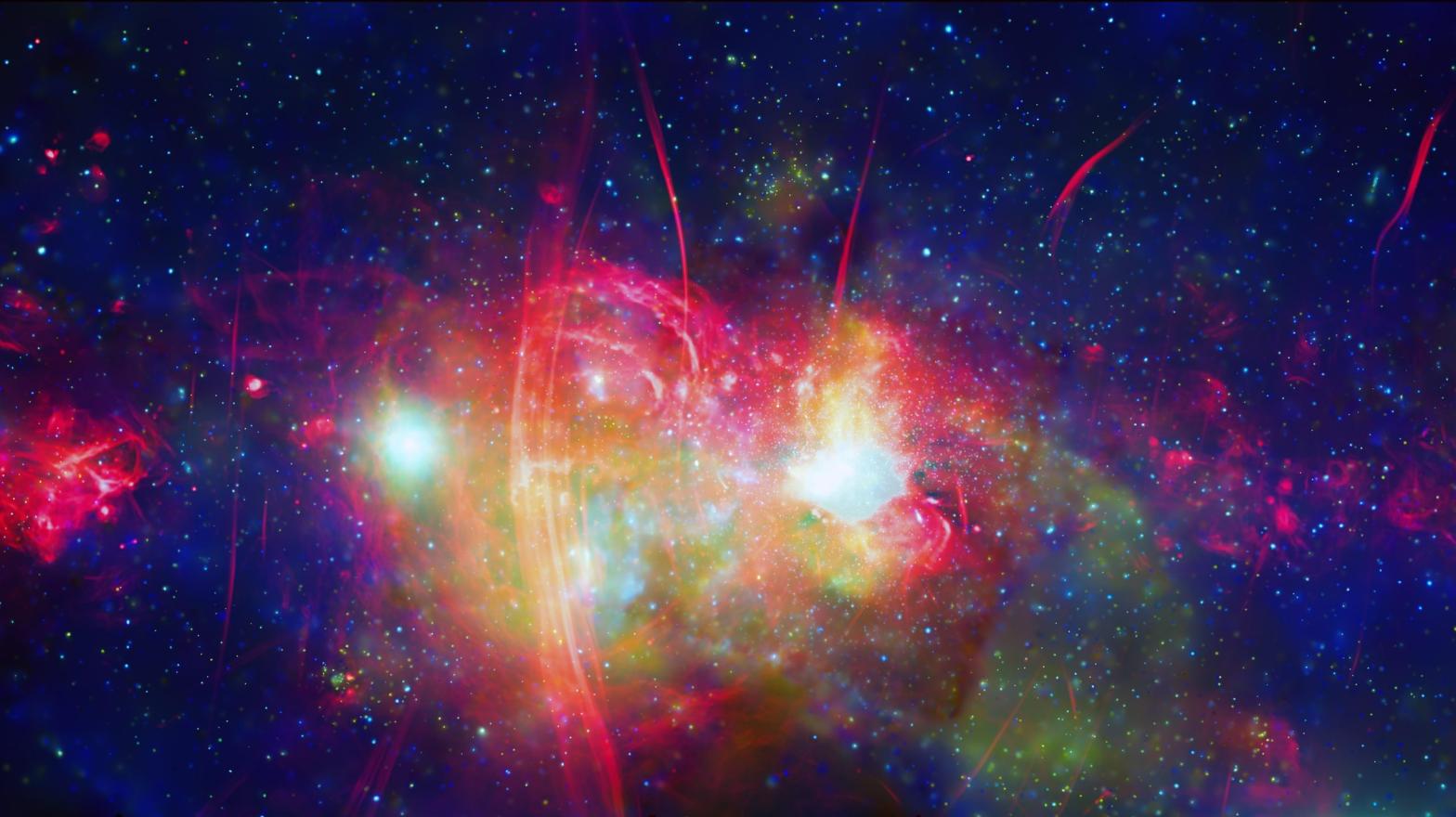 A view of the galactic centre — a region of space containing an abundance of stars, superheated clouds of gas, neutron stars, white dwarfs, and a supermassive black hole parked in the core.  (Image: X-Ray:NASA/CXC/UMass/D. Wang et al.; Radio:NRF/SARAO/MeerKAT)