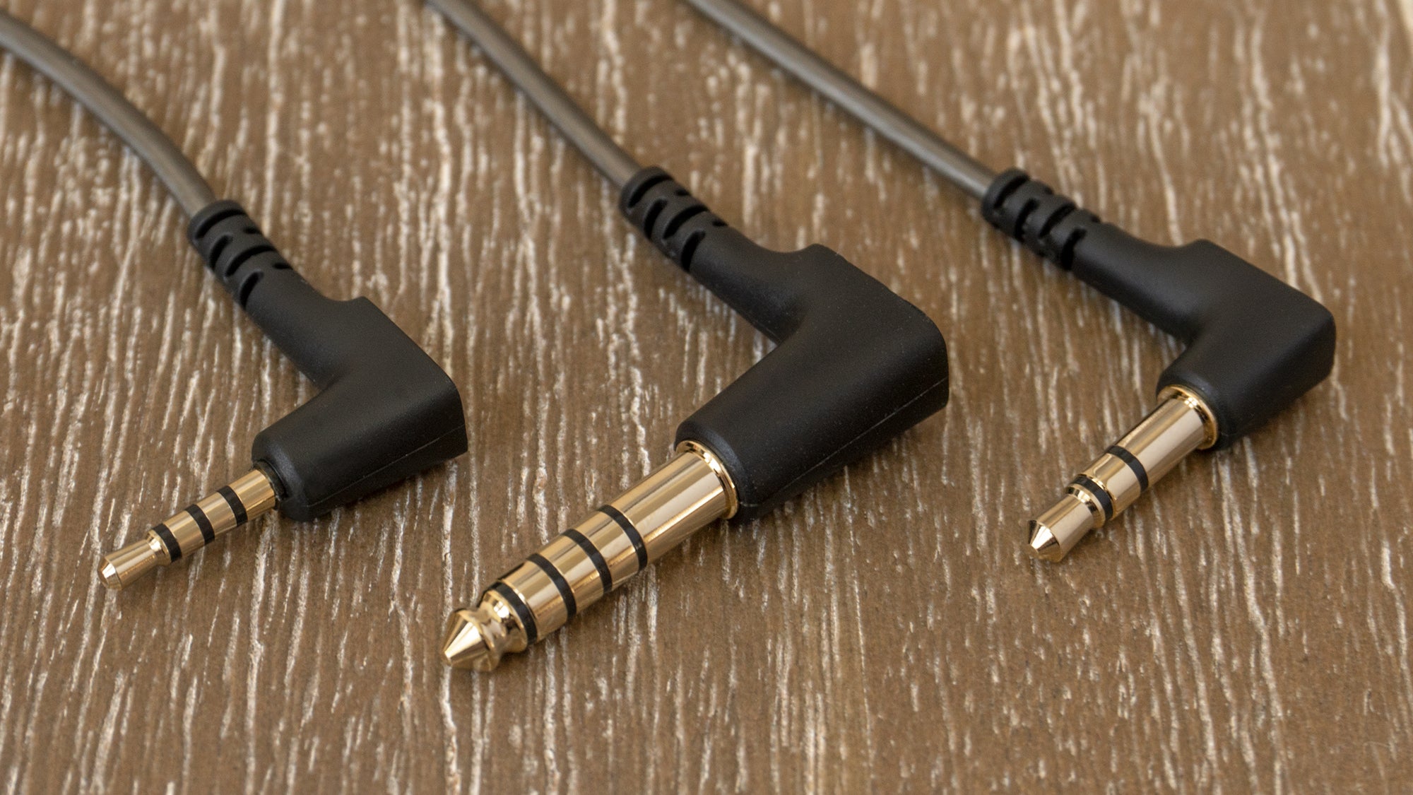 Sennheiser includes three cables with the IE 900s, one with a standard unbalanced 3.5mm connector, and two larger options that provide a balanced connection for eliminating unwanted audio hum. (Photo: Andrew Liszewski/Gizmodo)