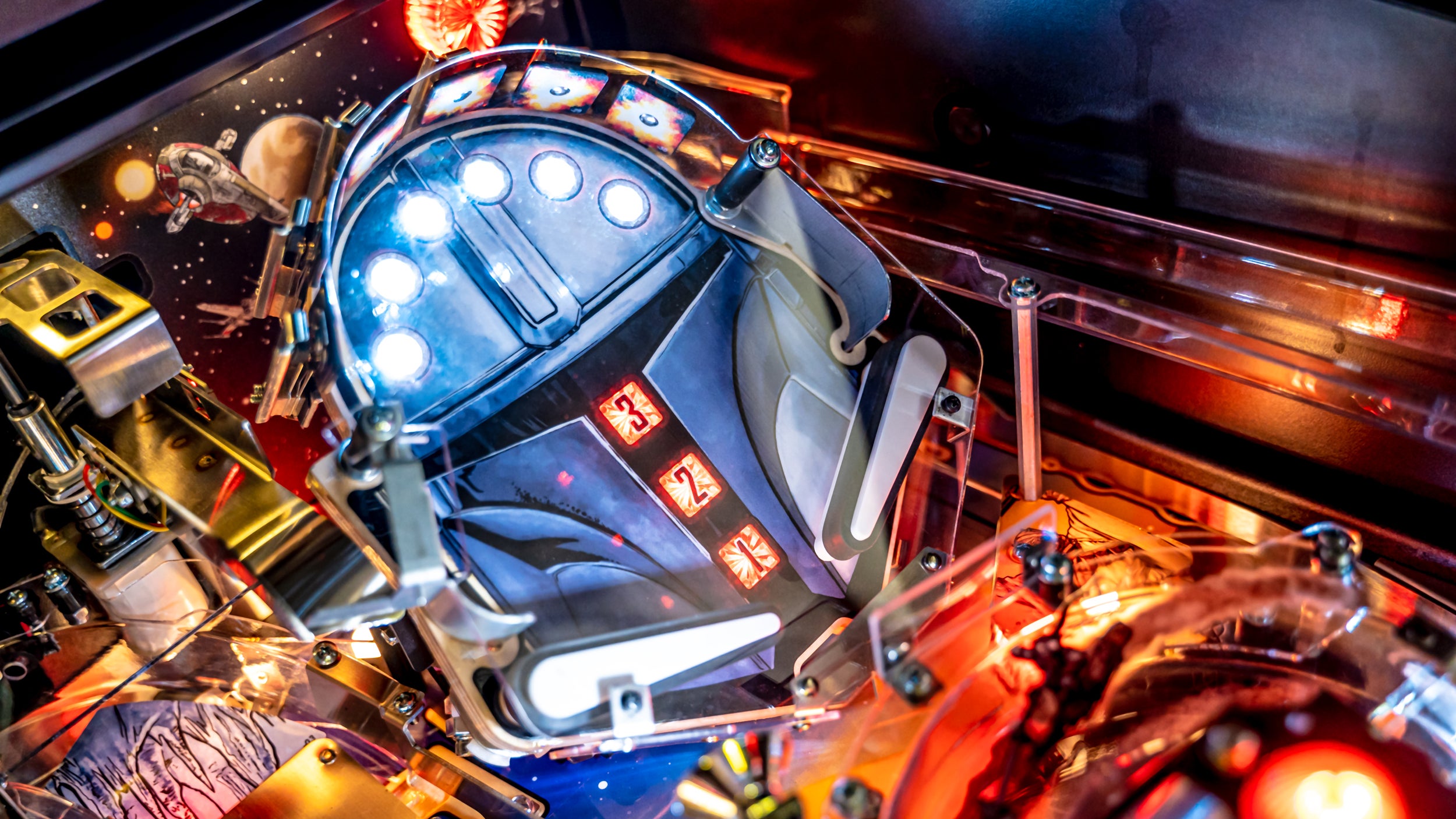 A secondary miniature playfield can be found in the upper corner of the table, which tilts up and down making it extra challenging to hit the light-up targets using the paddle flippers. (Image: Stern Pinball)