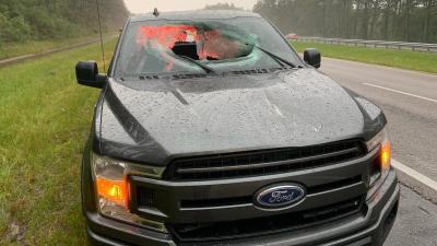 Lightning Strike Blasts Hunk Of Highway Through Ford Windshield, Injuring Two