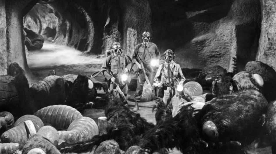 The humans venturing into the ant colony. (Screenshot: Warner Bros.)