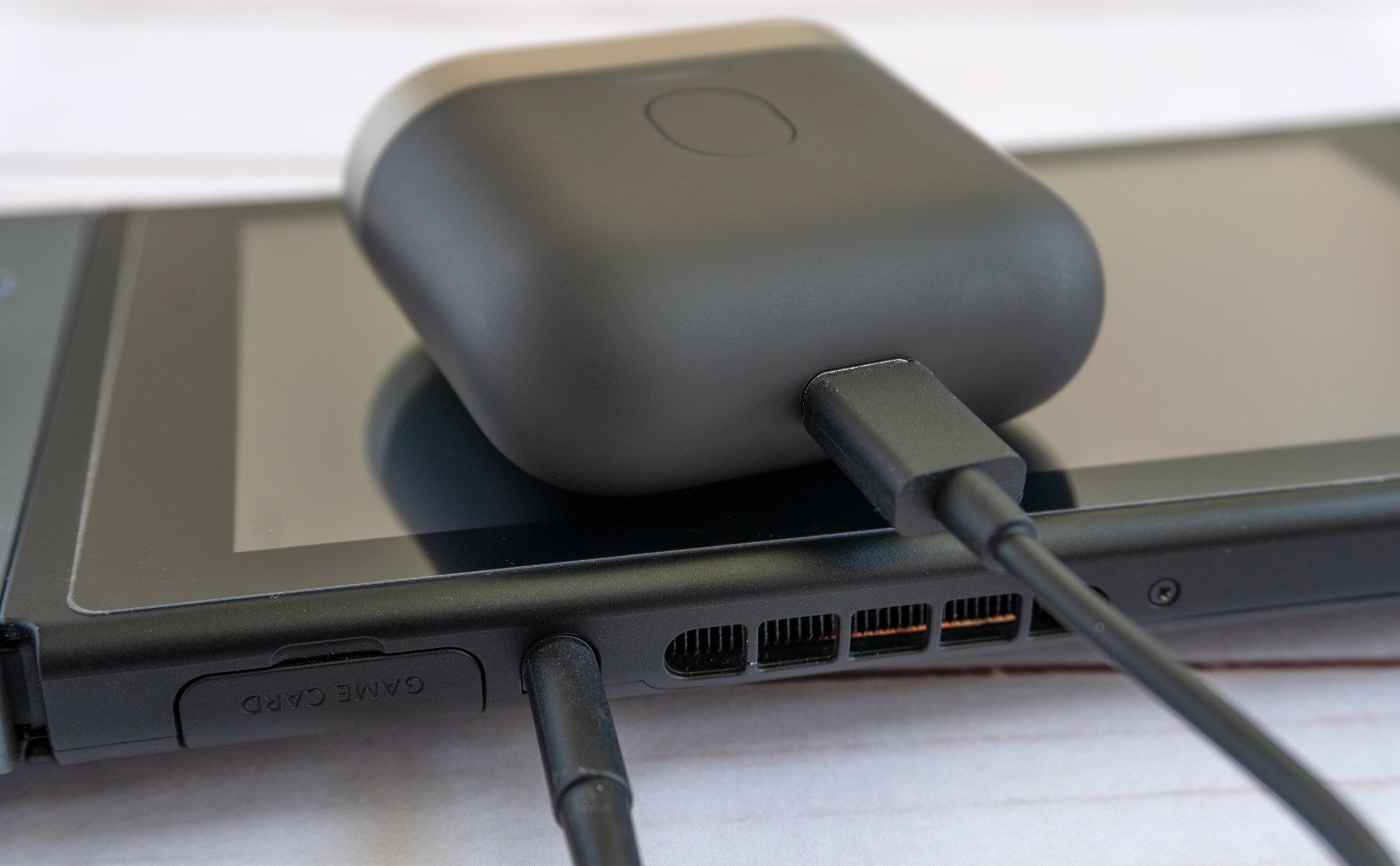 Being able to stream audio to the earbuds from any device through the charging case is a great feature, but it's dependent on a USB-C to 3.5-mm adaptor cable you'll need to remember to bring with you. (Photo: Andrew Liszewski/Gizmodo)