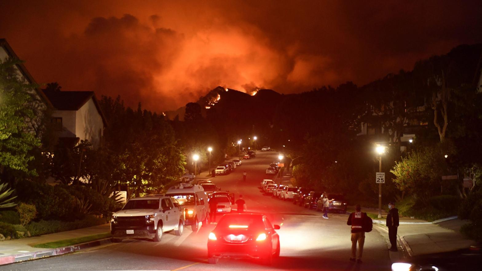 Flames from the Palisades Fire glow in the distance in Topanga, northwest of Los Angeles, May 15, 2021.  (Photo: Patrick T. Fallon, Getty Images)