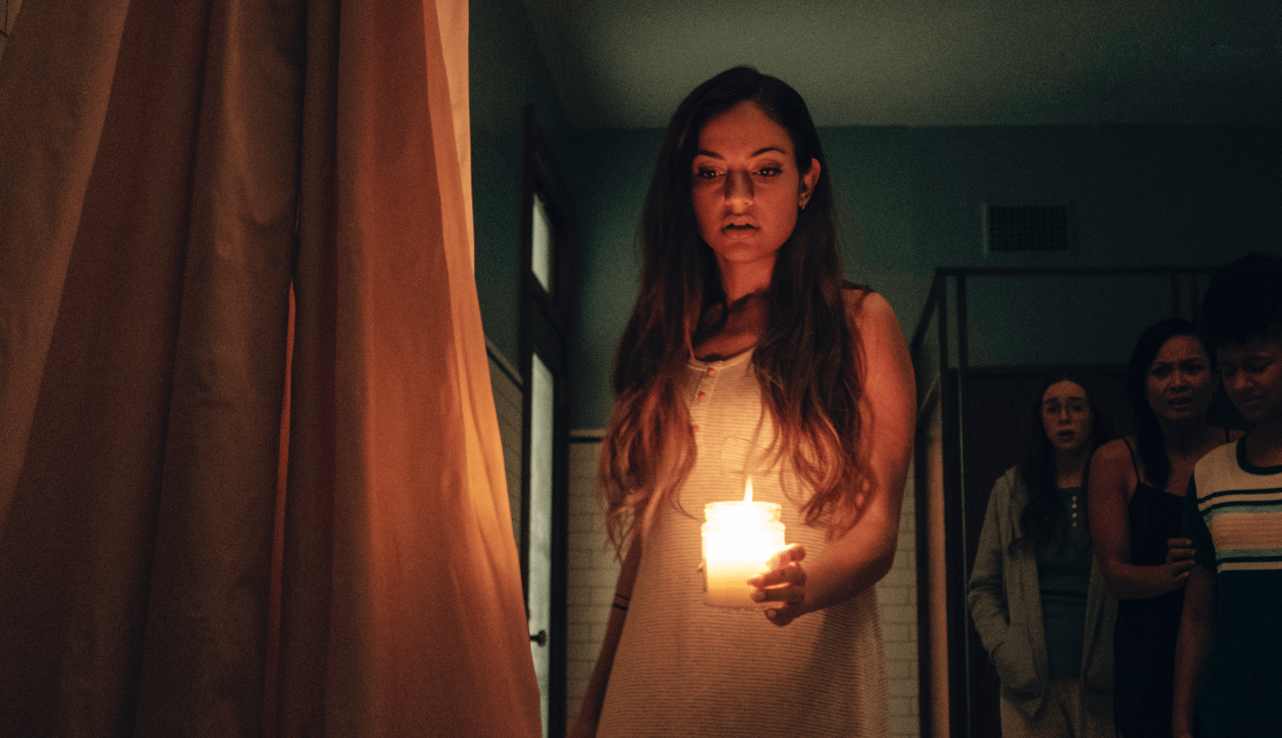 Ghost story fan Alice (Inanna Sarkis) is Seance's alpha mean girl. (Photo: RLJE Films/Shudder)