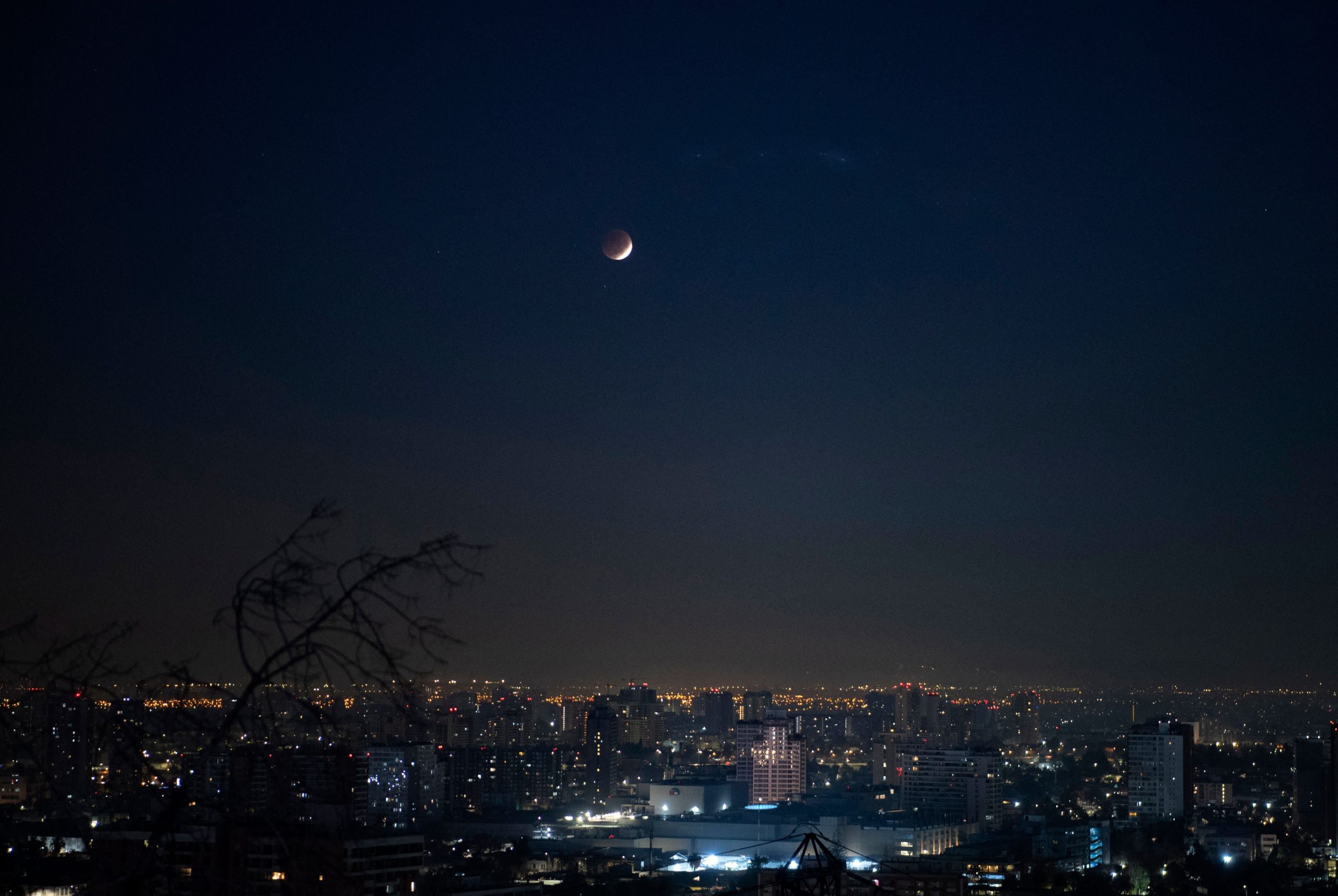 Picture taken during the penumbral phase of a total eclipse of the moon, seen from Santiago, on May 26, 2021. - A penumbra lunar eclipse appears when the moon enters the penumbra of the earth.  (Photo: MARTIN BERNETTI/AFP, Getty Images)
