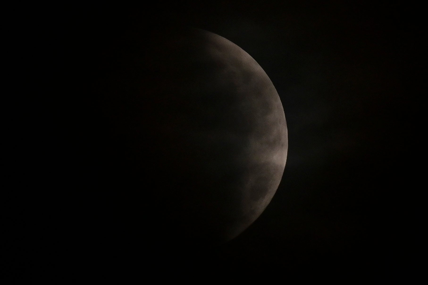 The full moon is seen during the partial eclipse in Mexico City on May 26, 2021. (Photo: PEDRO PARDO/AFP, Getty Images)