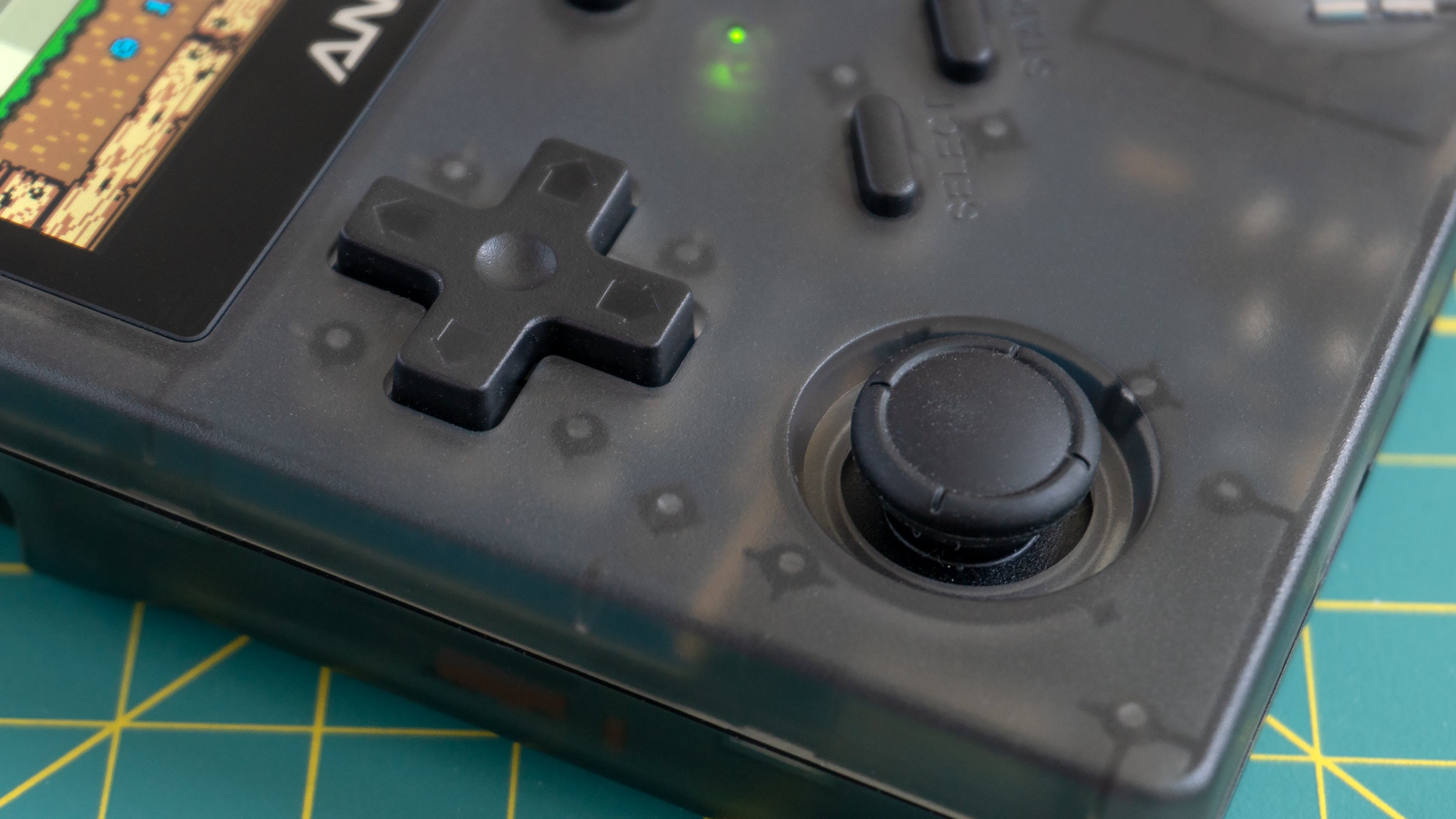 The choice to include just a single analogue joystick is questionable, and its position makes it hard to reach while keeping fingers on the shoulder buttons on back. (Photo: Andrew Liszewski/Gizmodo)