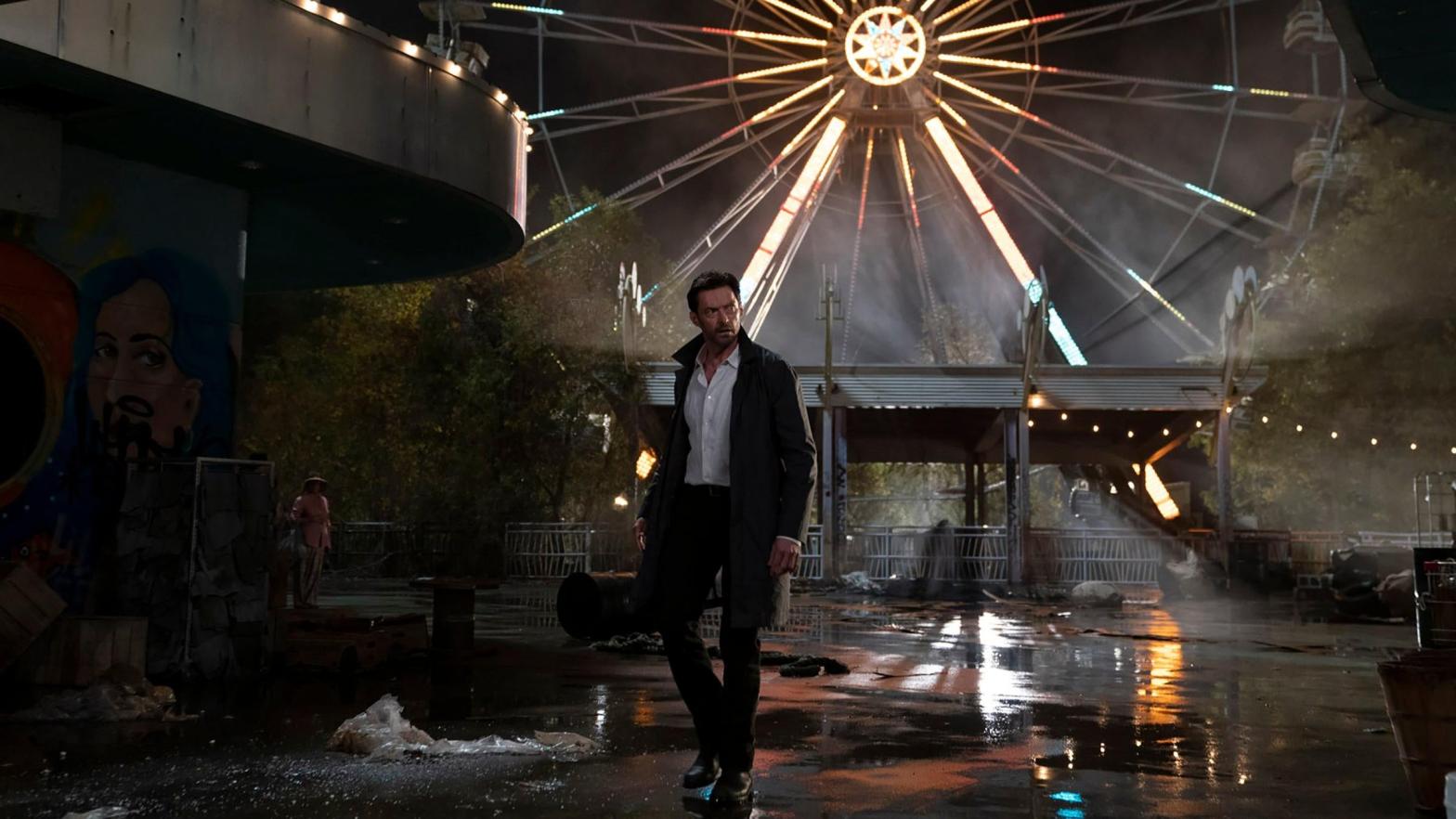Nick Bannister (Hugh Jackman) strides through the night in Reminiscence. (Image: Ben Rothstein/Warner Bros.)