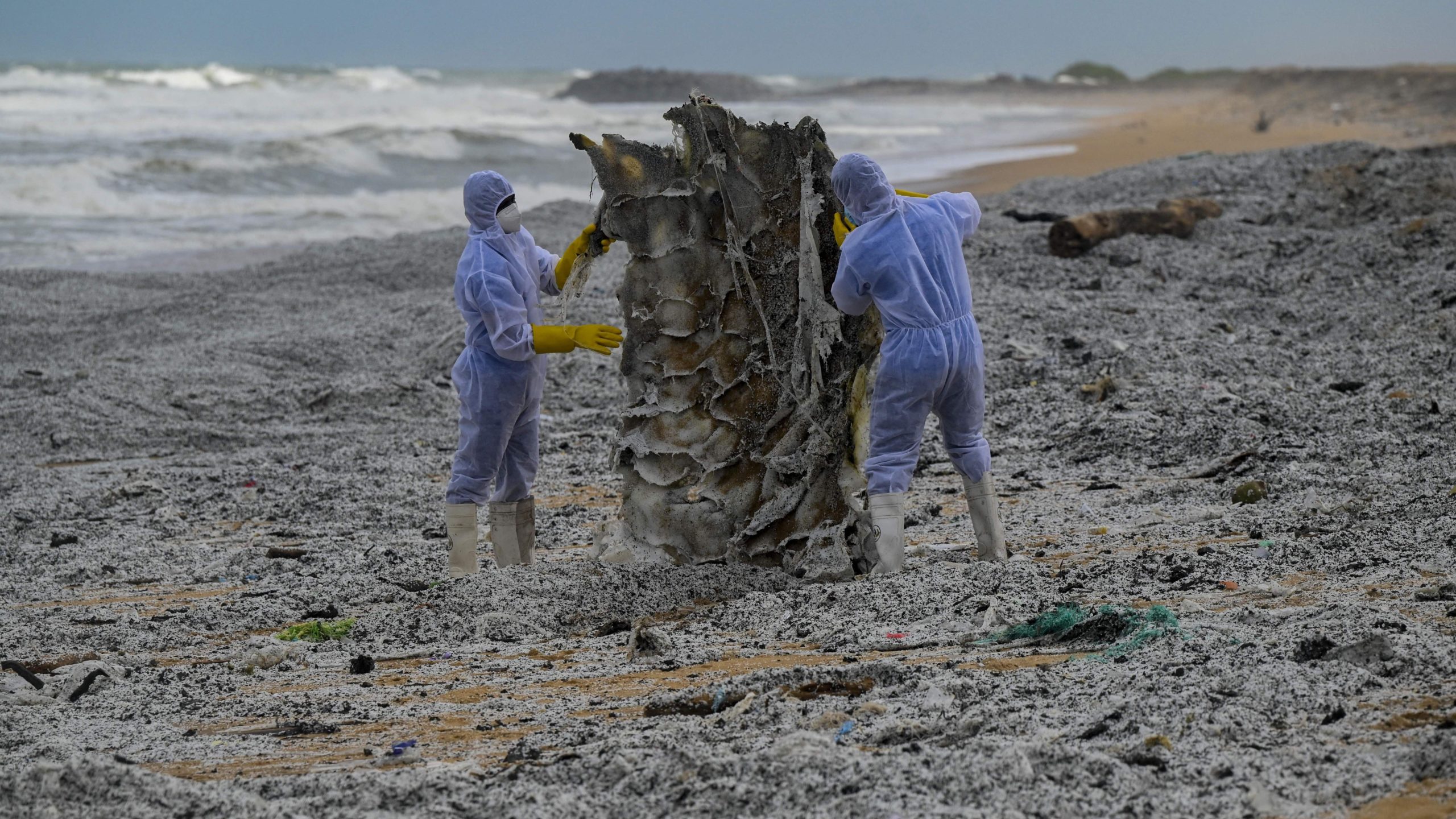 Sri Lankan Navy soldiers work among a sea of plastic to remove debris washed ashore from the MV X-Press Pearl on May 28. (Photo: Ishara S. Kodikara/AFP, Getty Images)