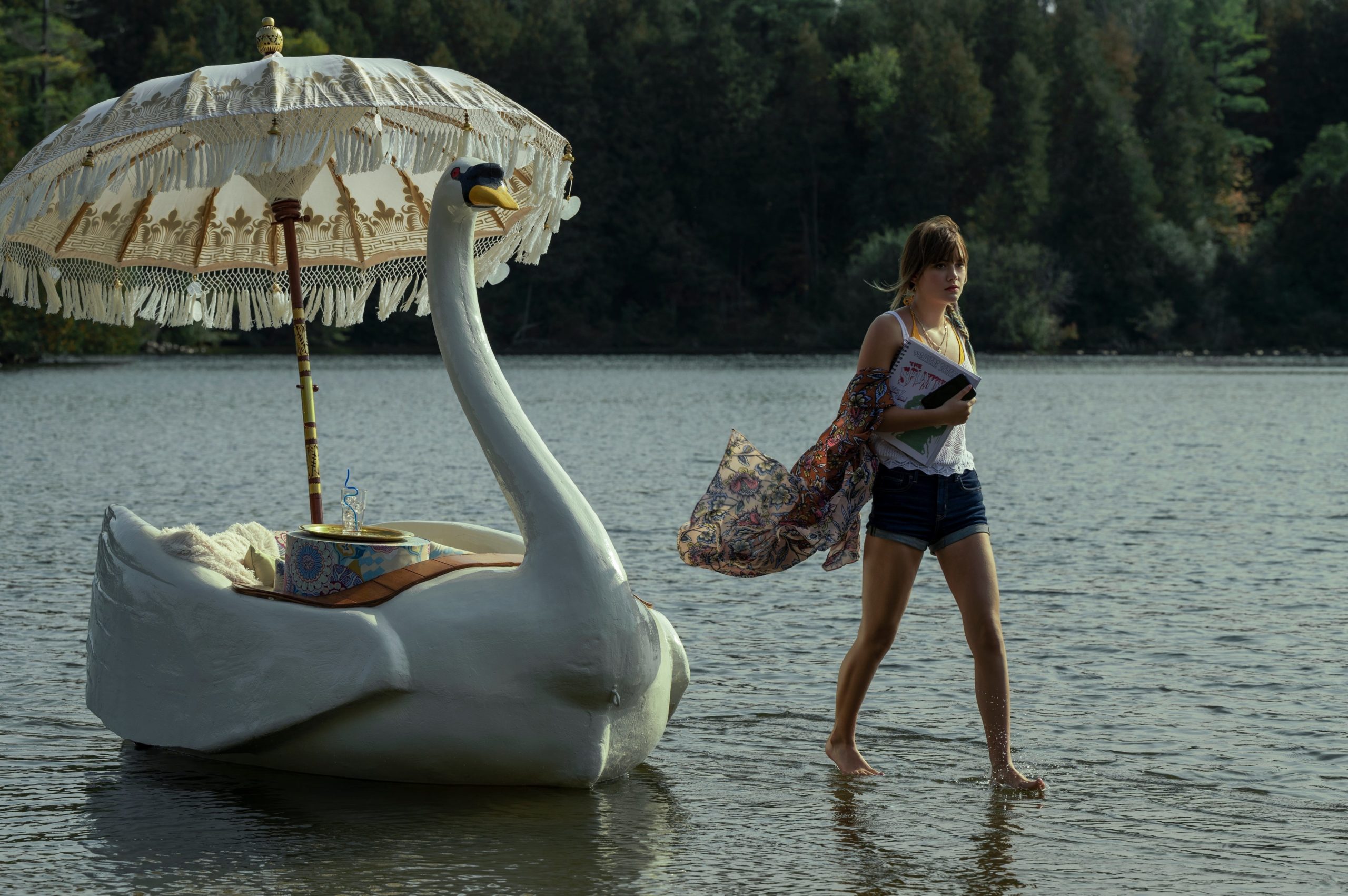 Kinsey... walks on water alongside a swan boat, as you do. (Image: Amanda Matlovich/Netflix)