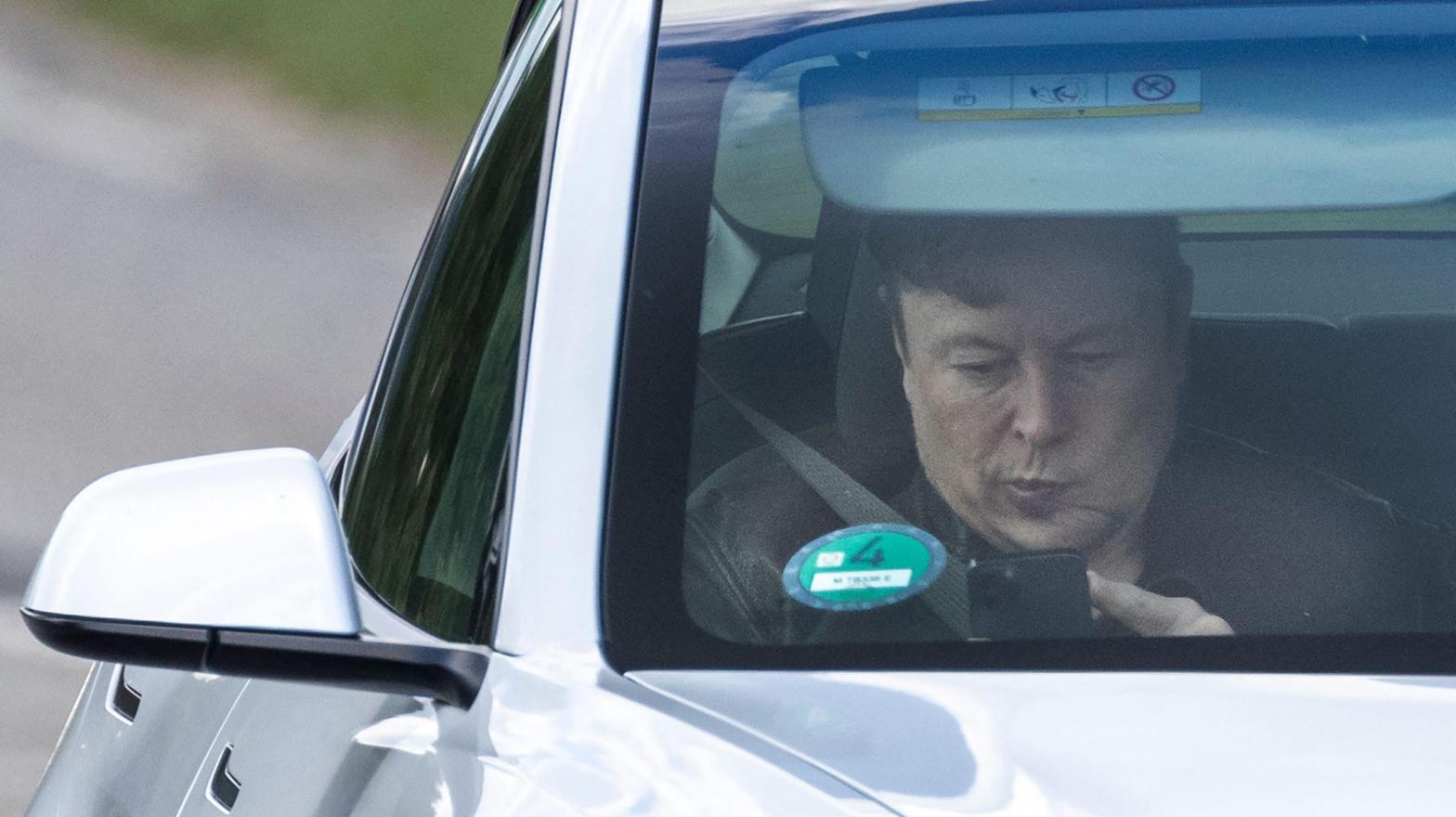 Tesla CEO Elon Musk sits in a car arriving to the construction site for a new Tesla in Gruenheide near Berlin, northeastern Germany on May 17, 2021. (Photo: Odd Andersen/AFP, Getty Images)