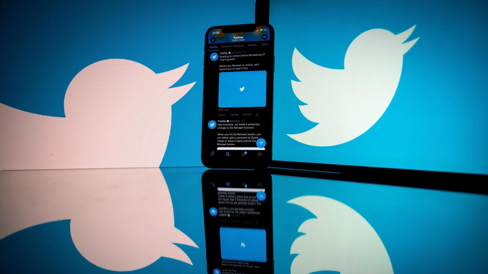 The Twitter logo displayed on a phone. (Photo: Lionel Bonaventure/AFP, Getty Images)