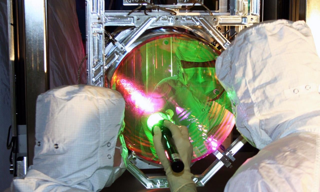 LIGO technicians check out one of the observatory's mirrors. (Image: Caltech/MIT/LIGO Lab)