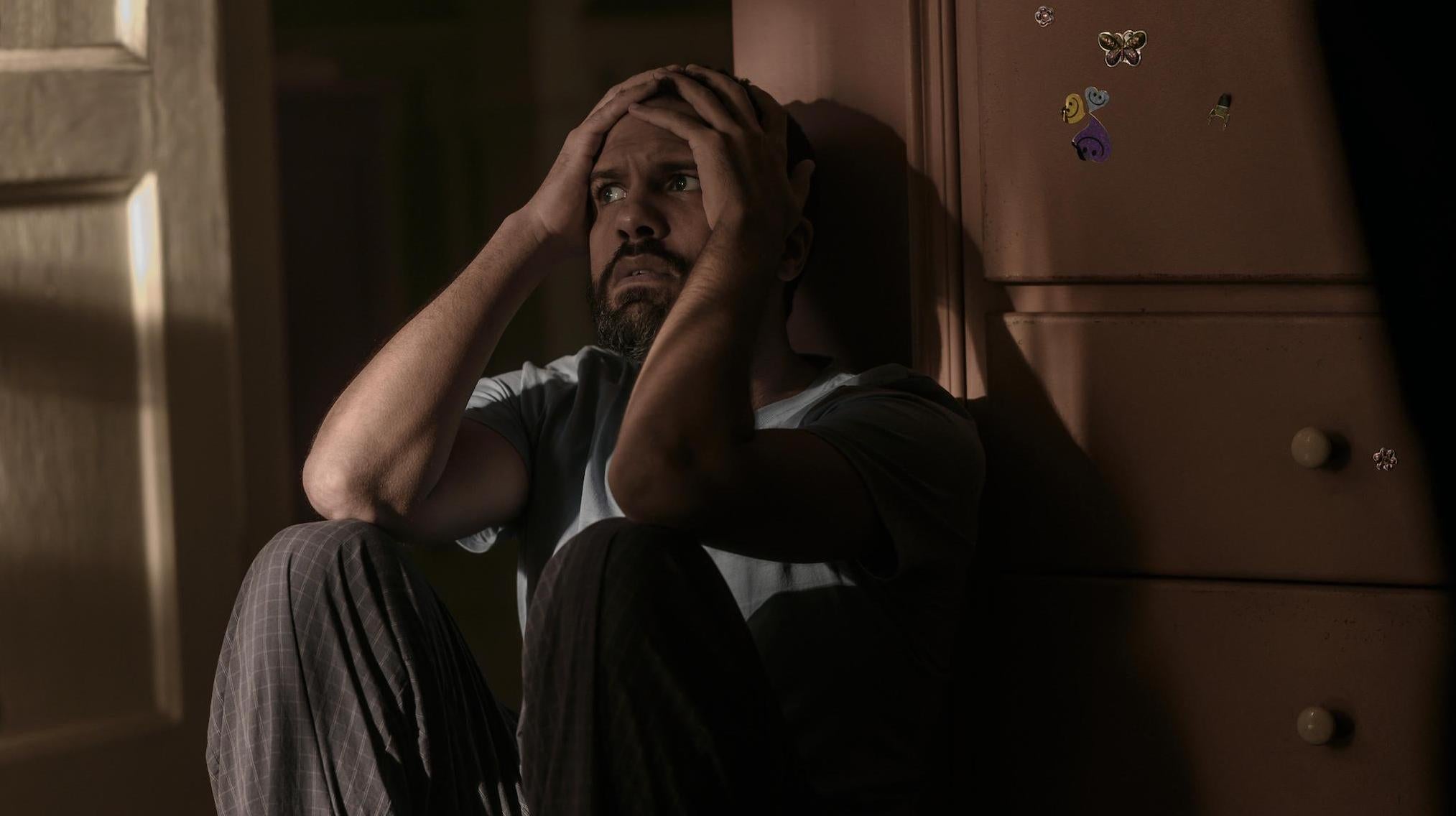 Luke (O.T. Fagbenle) struggles to cope with June's actions.  (Image: Hulu)