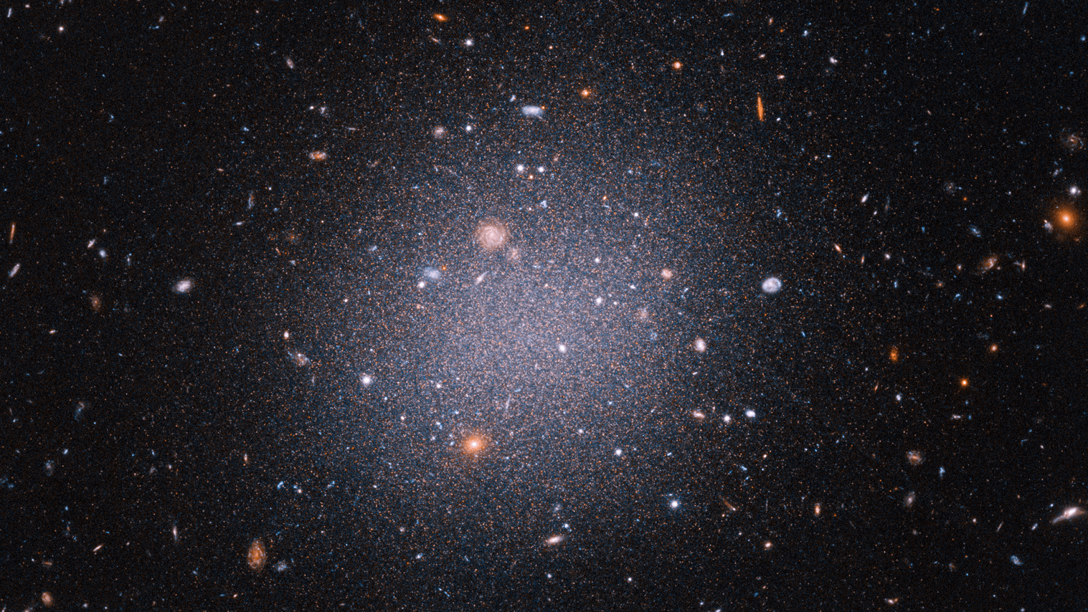 The ultra-diffuse galaxy DF2 seems strangely devoid of dark matter. (Image: SCIENCE: NASA, ESA, STScI, Zili Shen (Yale), Pieter van Dokkum (Yale), Shany Danieli (IAS) IMAGE PROCESSING: Alyssa Pagan (STScI))