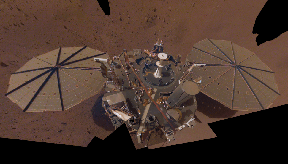 A selfie taken by InSight in early 2019 shows that dust was already settling on the solar arrays.  (Image: NASA/JPL-Caltech)