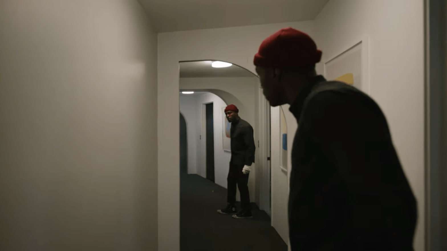 Anthony (Yahya Abdul-Mateen II) gets tempted by a mirror in Candyman. (Screenshot: Universal Pictures)