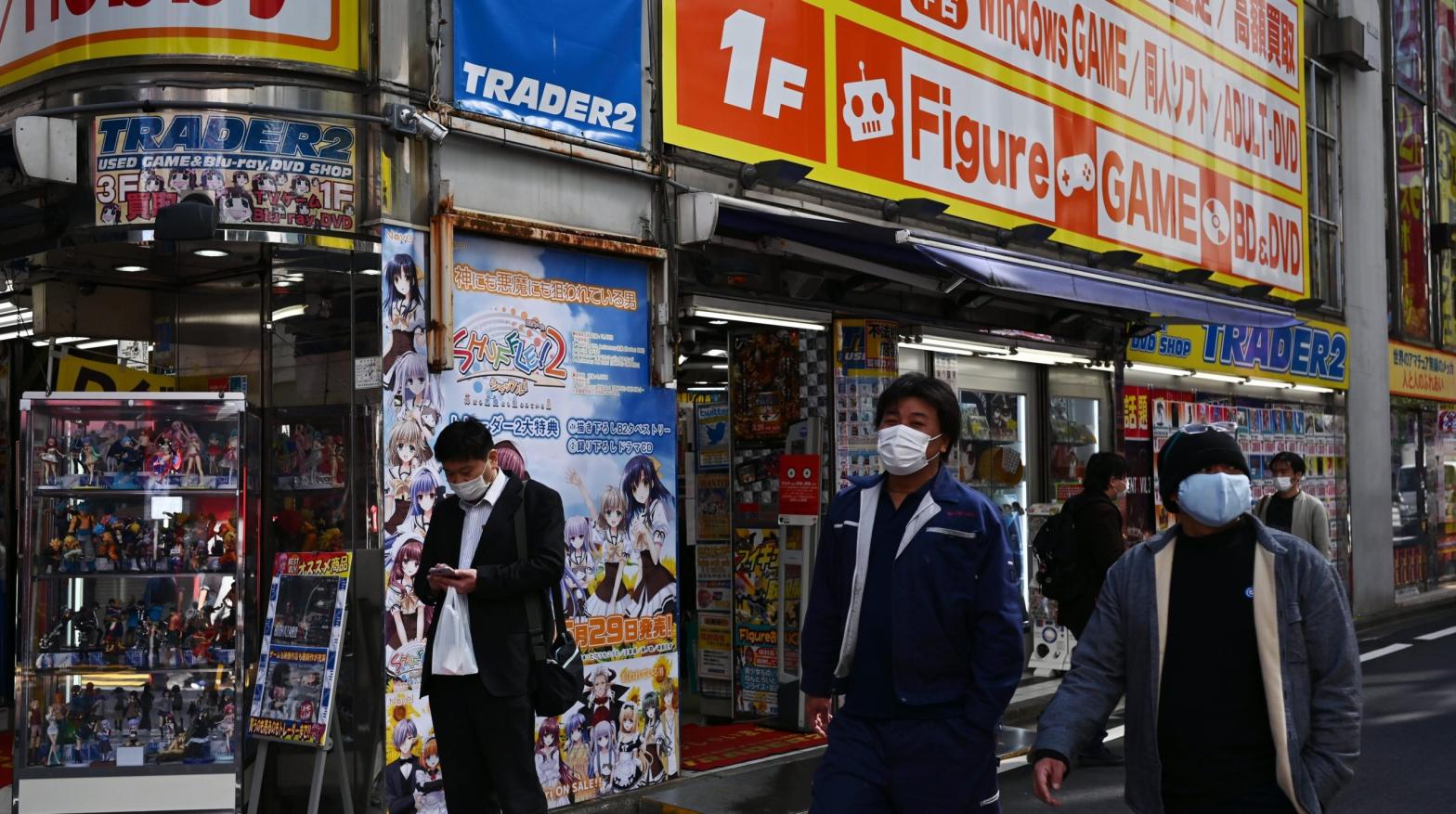 Pedestrians walking in Tokyo's famous Akihabara district, the epicentre of its retail anime and manga industry, in April 2020. In Japan, illegally downloading movies, music, manga, magazines, or academic publications can result in criminal penalties of up to two years in prison and a two million yen fine. (Photo: Charly Triballeau/AFP, Getty Images)