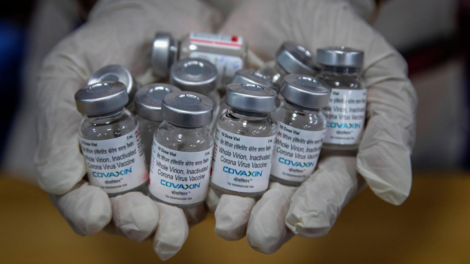 In this May 8, 2021 photo, a health worker displays empty vials of covid-19 vaccines in Gauhati, India.  (Photo: Anupam Nath, AP)