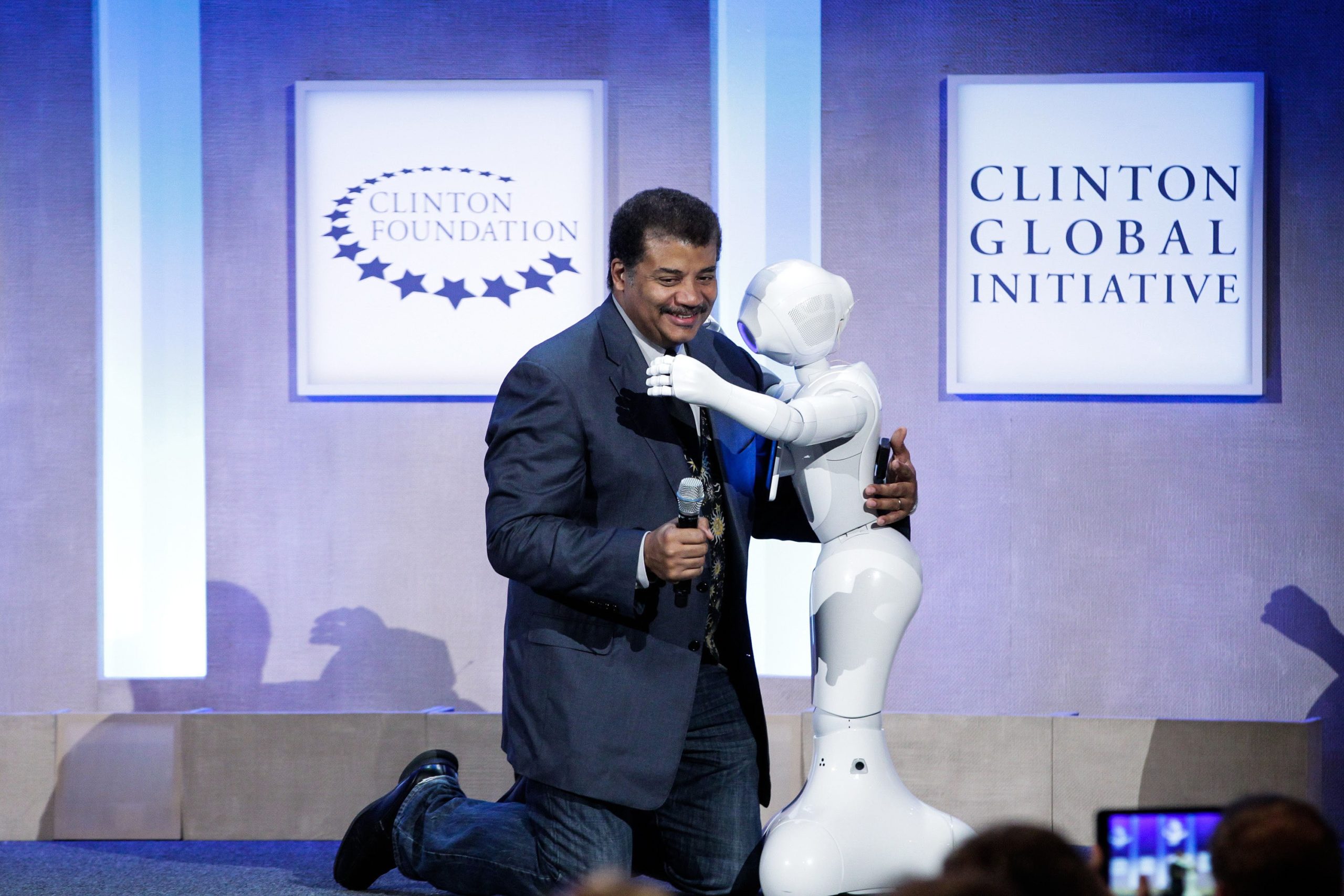 Neil deGrasse Tyson hugs Pepper at the Looking to the Next Frontier session during the 2015 Clinton Global Initiative's Annual Meeting at the Sheraton New York Hotel & Towers on September 28, 2015 in New York City. (Photo: JP Yim, Getty Images)