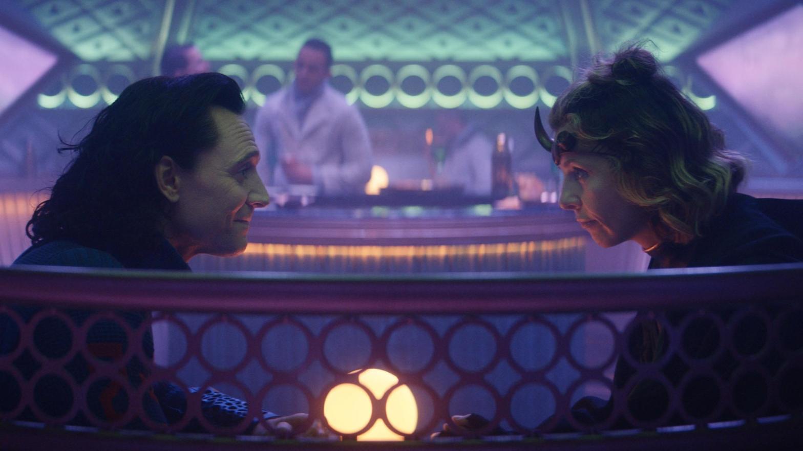 Loki and Sylvie, sitting in a booth. (Photo: Marvel Studios)
