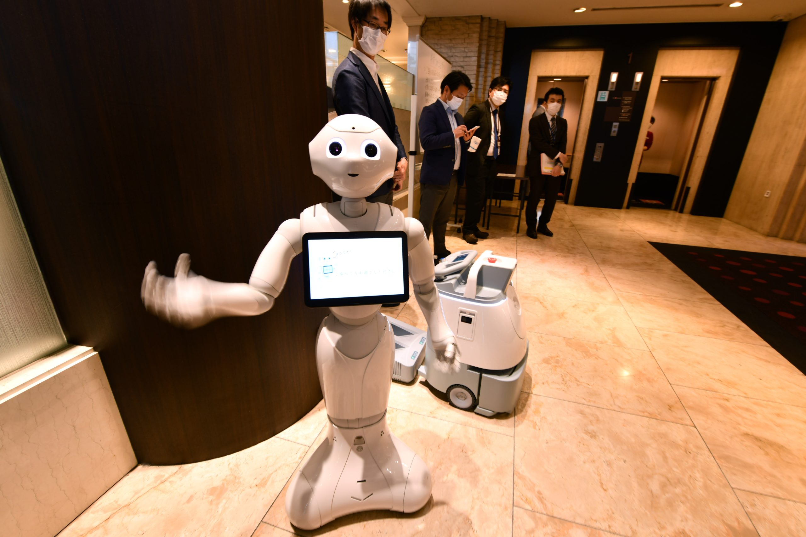  Pepper and cleaning robot Whiz are seen during a demonstration at the entrance of a hotel for patients suffering mild symptoms of covid-19 in Tokyo, Japan on April 30, 2020. (Photo: Kazuhiro Nogi, Getty Images)
