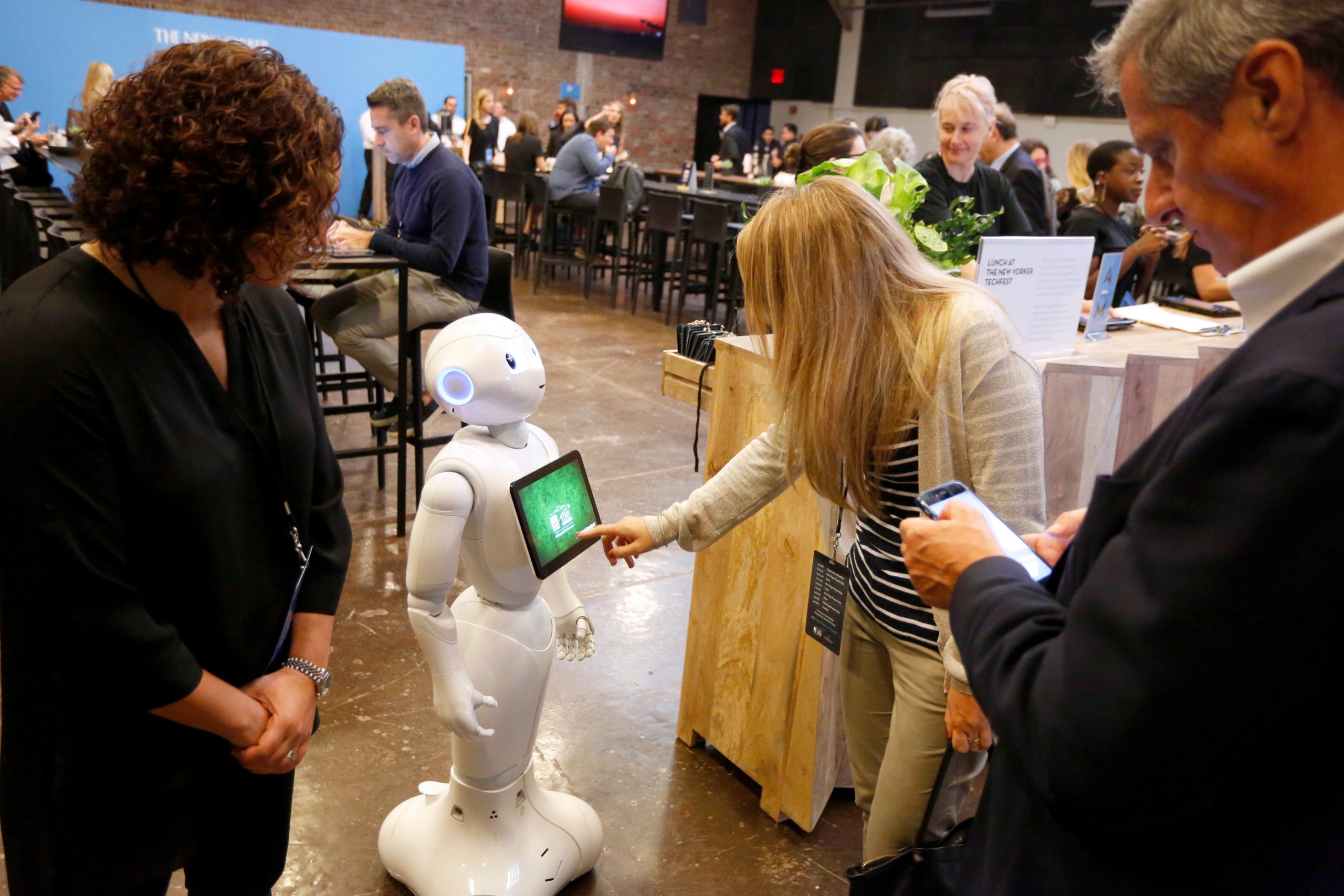 Guests interact with Pepper the robot during the 2017 New Yorker TechFest at Cedar Lake on October 6, 2017 in New York City.  (Photo: Brian Ach/Getty Images for The New Yorker, Getty Images)