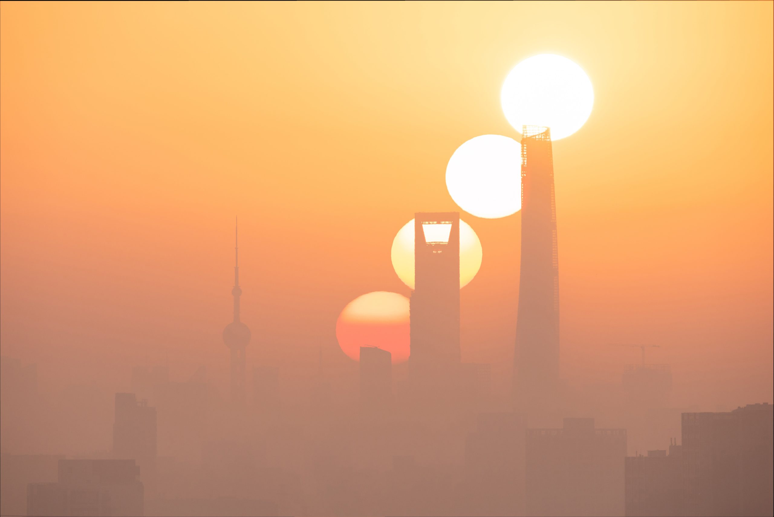 Four different exposures showing a sunrise over Shanghai.  (Image: Royal Observatory Greenwich/Jiajun Hua (China))