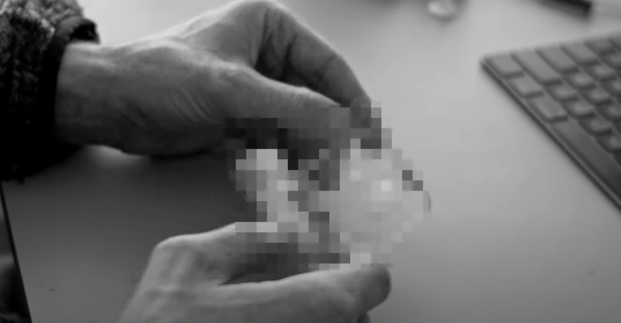 Here's another screenshot from Nothing's teaser doc, and even tough it has been blurred out, the appearance of the object strongly suggests we're looking at a clear plastic case.  (Screenshot: Sam Rutherford)