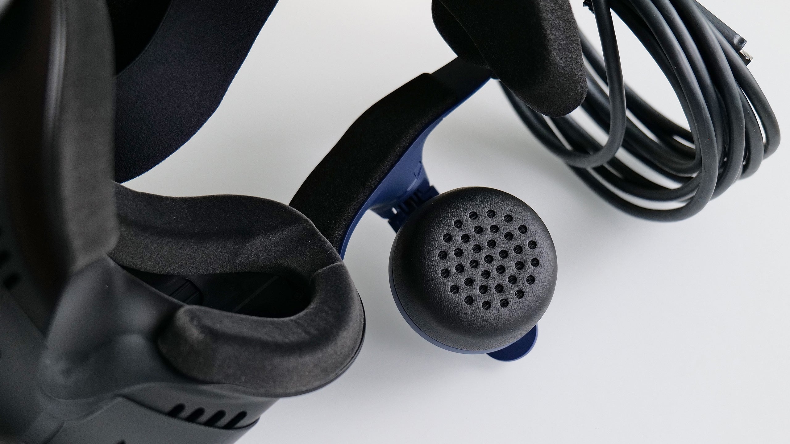The Vive Pro 2's built-in spatial sound speakers have soft faux leather earpads — just in case you bump into anything while in VR.  (Photo: Sam Rutherford)